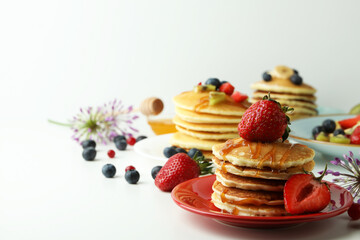 Concept of delicious dessert with pancakes on white table