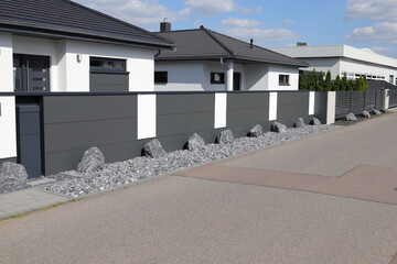 a new house with a metal sliding gate
