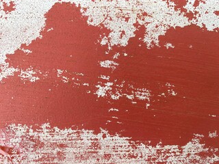 Closeup of peeling paint on a metal bar.