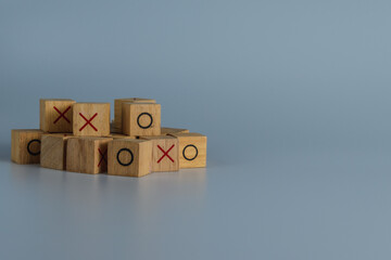 OX game or Tic Tac Toe wooden box. Business marketing strategy planning concept.