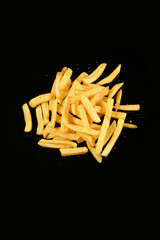 french fries on black background