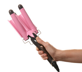 Woman holding modern triple curling iron on white background, closeup