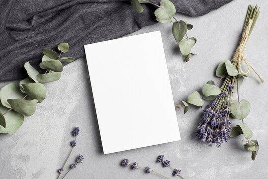 Greeting or invitation card mockup with dry lavender flowers and eucalyptus twigs