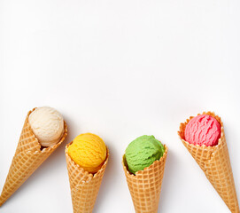 Assorted of ice cream in cones on white background. Colorful set of ice cream of different flavours. Ice cream isolated for your design