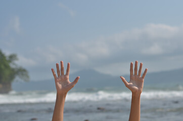 male hands happy and motivate enjoying gesture at beach or summer holiday