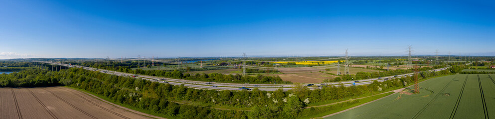 Panoramic aerial view of the bridge and power line over the Kiel Canal by Rader high bridge in...