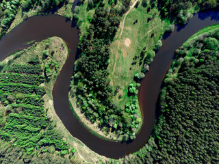 Aerial view of the forest river..