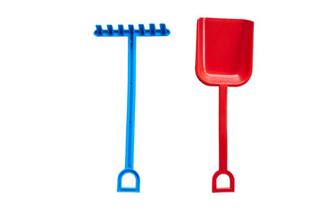 toy shovel and rake,children's toy rake and shovel on a white background