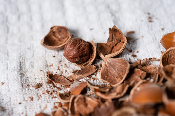 Chopped hazelnuts on a towel. Dried nut husks and kernels.