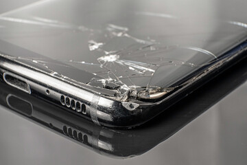 broken phone display on black background