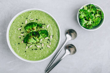 Broccoli cream soup with sunflower and sesame seeds.