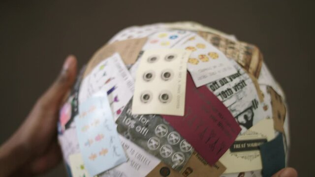 Hands holding ball of gift cards, Nottingham, Nottinghamshire, UK