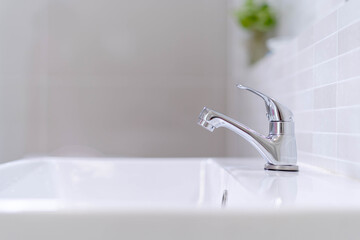 The bathroom faucet is turned off to save water energy and protect the environment. water saving...