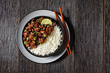 Cauliflower wings on a black bowl, copy space