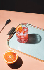 Aperitif with Campari bitter, soda and red orange, italian cocktail, Milan style (style Milanese), ...