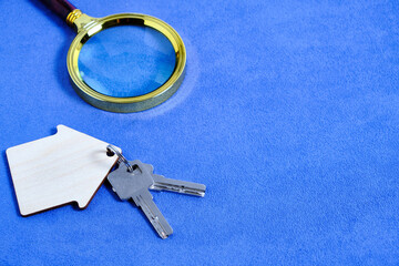 Magnifying Glass and Keys House or Apartment Concept of Buying and Selling Housing, Mortgages and...