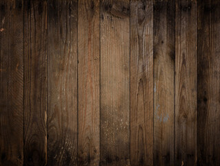 Dark wooden background. Weathered vignetted rustic wood texture with rusty nails.