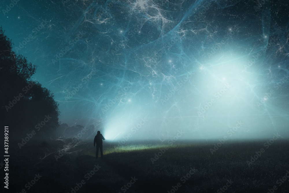 Aufkleber a science fiction concept of a man standing in a spooky field in the countryside, holding a torch. w