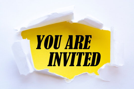 You are invited written under torn paper on yellow background