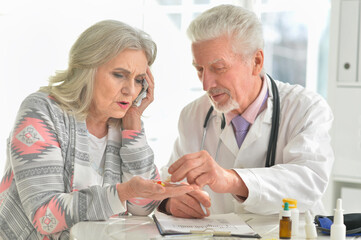 Senior doctor with elderly patient