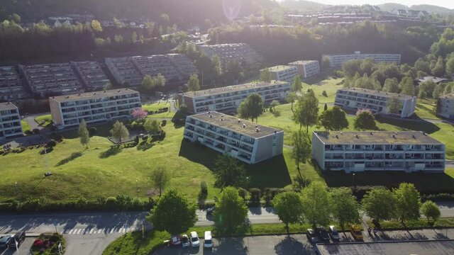 Modern design apartment buildings in family friendly green park area - Mornings sun aerial view - Asane Flaktveit Nyborg Liavegen Norway