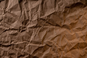 crumpled paper.sheet of brown cardboard paper. detailed high resolution texture. abstract background for wallpaper.