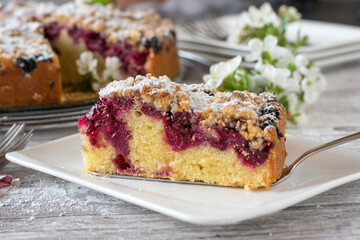 Cherry cake with crumbles on a plate