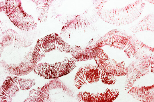 Red kisses isolated on white background. Female lip prints. Lots lipstick kisses