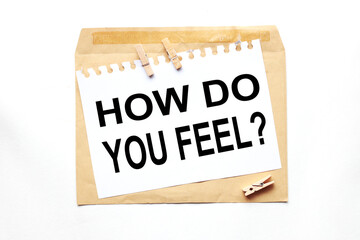 how do you feel.text on white paper on craft notebook