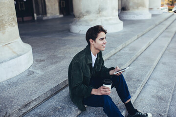 Satisfied man browsing smartphone during break