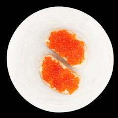 Two loaves of bread with red salmon roe shot from above