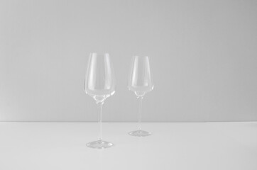 The glass is empty for wine. Two wine glasses on a white background