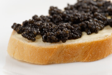 Real, not imitated, beluga caviar on bread with butter
