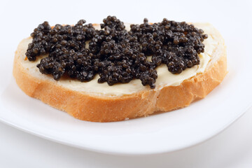 Real, not imitated, beluga caviar on bread with butter