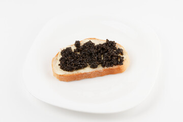 Real, not imitated, beluga caviar on plate, isolated