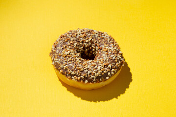 donut with sweet powder on a yellow background
