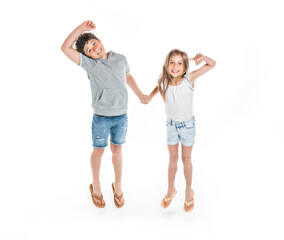 Portrait of cute girl and boy on studio white background