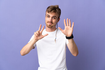 Young handsome blonde man isolated on purple background counting eight with fingers