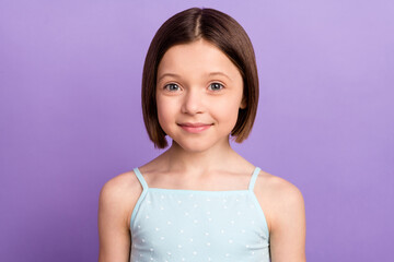 Photo of young happy little girl good mood charming face wear singlet isolated on purple color background