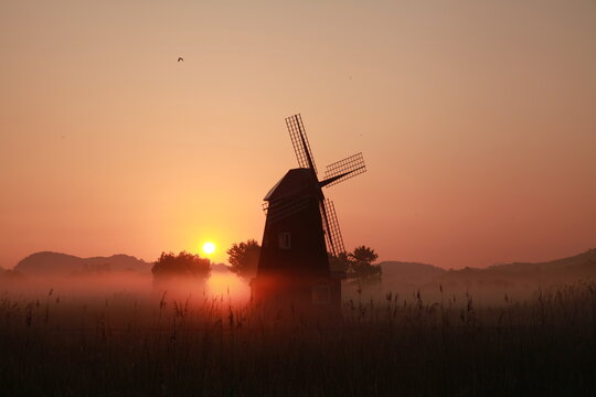 Korean natural scenery, Sorae Wetland Park Sunrise with a foggy windmill