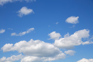 Naklejka na ściany i meble blue sky with white clouds of various shapes, sunny day, texture