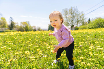 nice and Cute baby girl walking outdoors