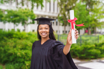 happy afro american university graduates at graduation ceremony