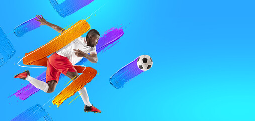 Art collage. Young man, soccer footbal player training isolated in neon light on blue background....