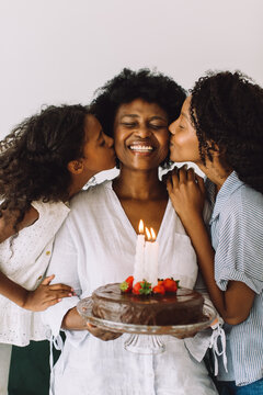 Girls wishing mother a happy birthday