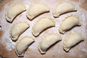 National dish dumplings on a wooden surface.