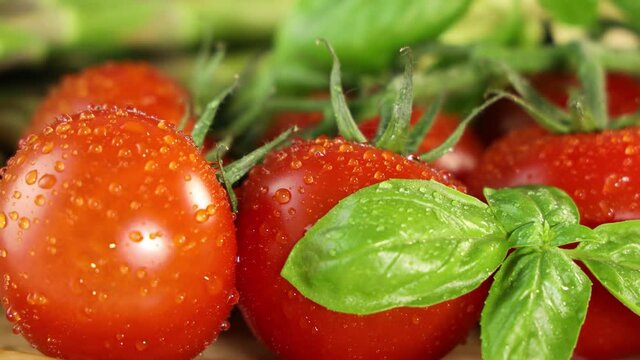 Delicious fresh tomatoes with green basil 