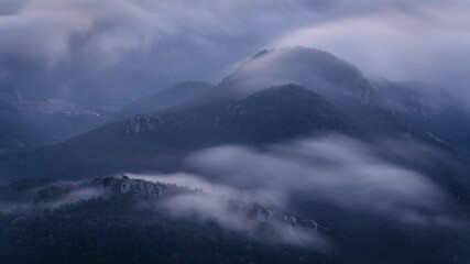 Blancafort castle, between fogs, at sunrise (Berguedà, Catalonia, Spain, Pyrenees)