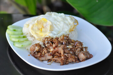 Rice with stir fried pork with garlic, stir fried pork with sunny side up egg