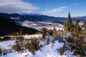 Cerdanya valley and Serra de Cadí range on a winter day after a snowfall (Cerdanya, Catalonia, Spain, Pyrenees)